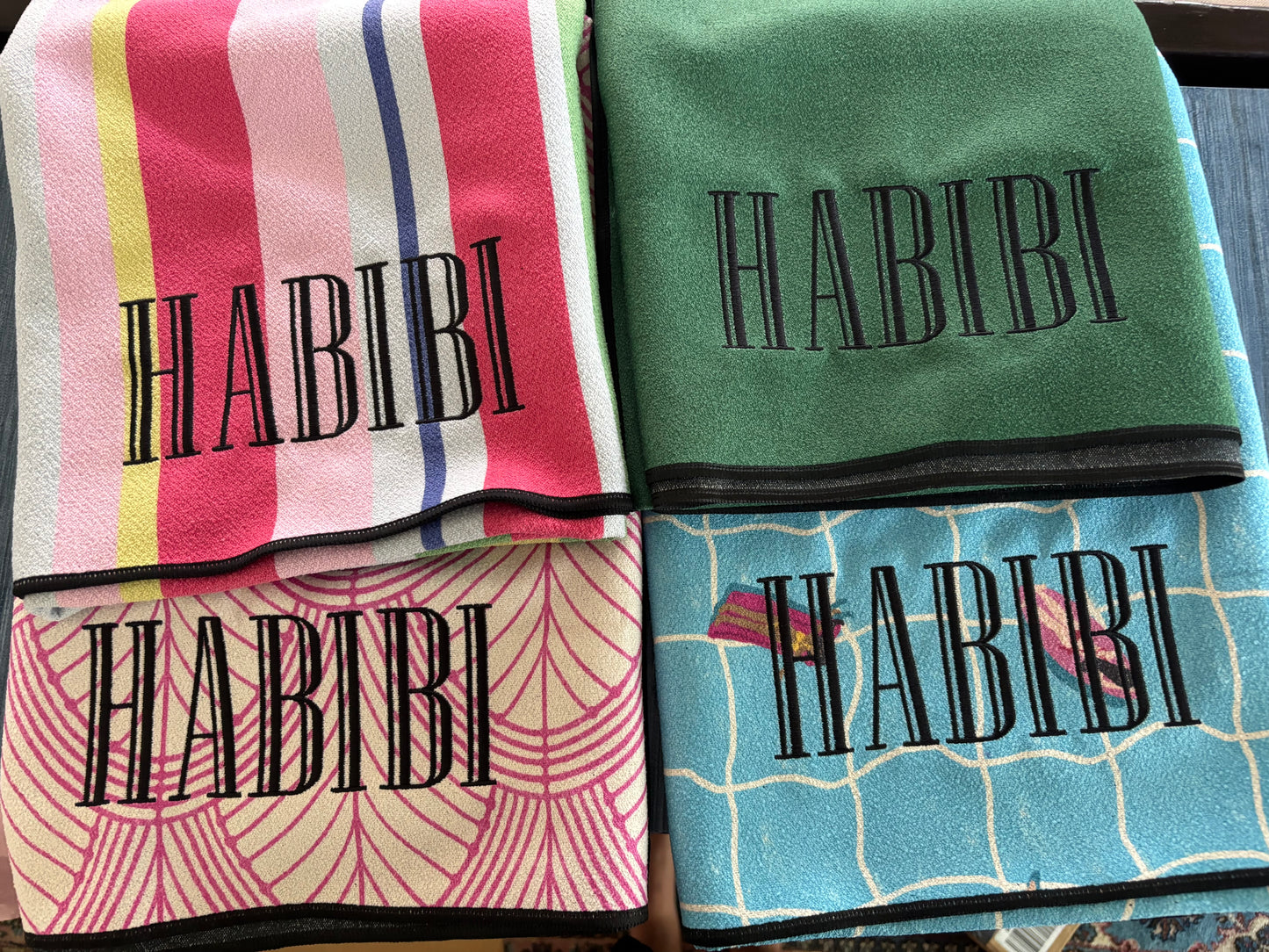 Personalized beach towels with embroidered name on colorful striped and patterned microfiber geometry towels