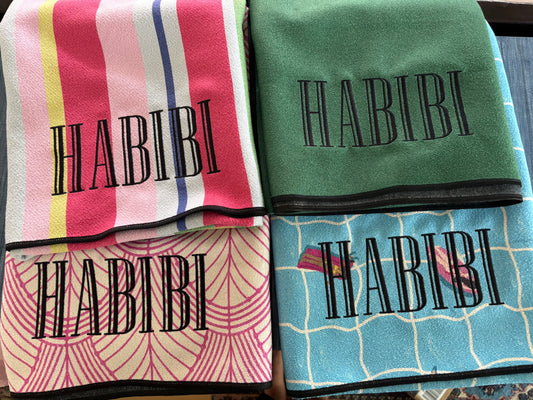Personalized beach towels with embroidered name on colorful striped and patterned microfiber geometry towels
